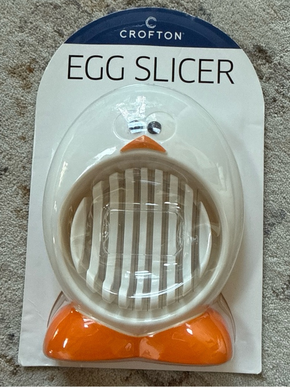 Croton White Egg Slicer with Orange Accents